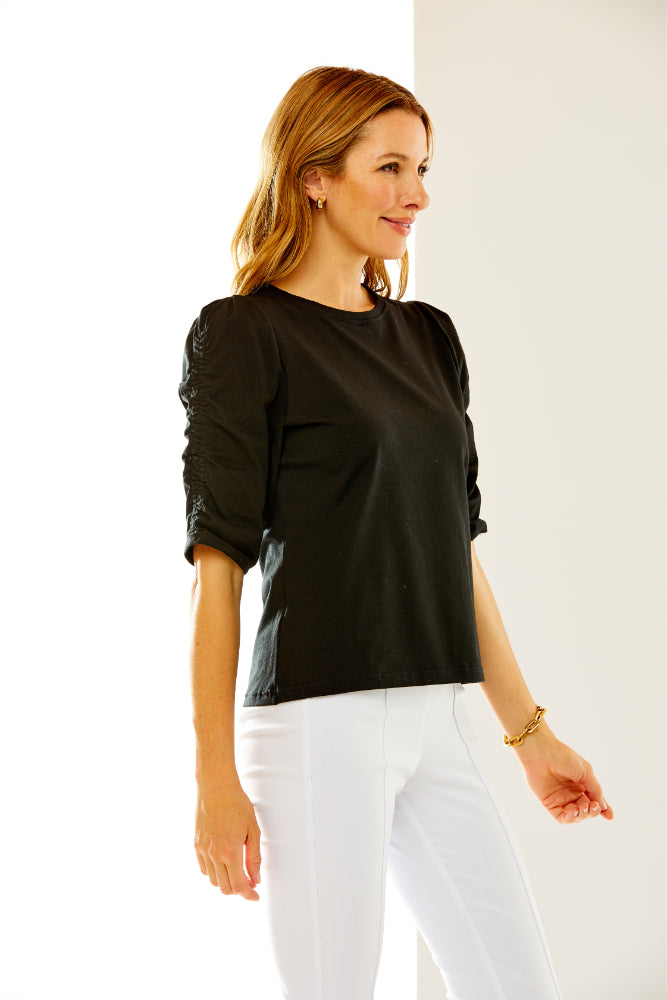 Woman in black ruched top
