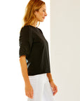 Woman in black ruched top