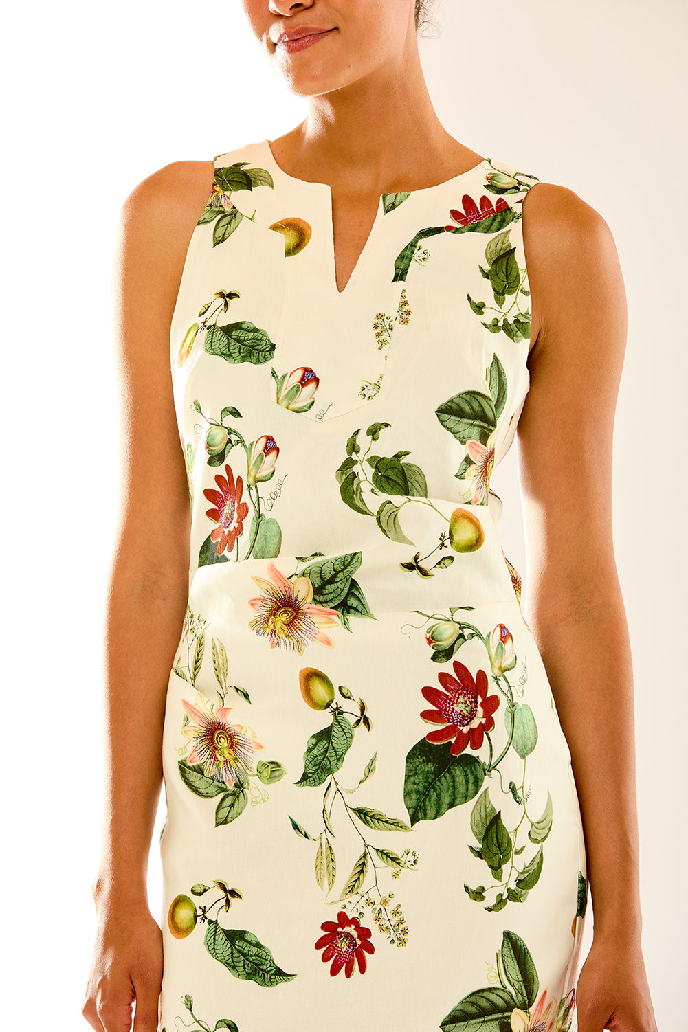 Woman in sun garden print dress