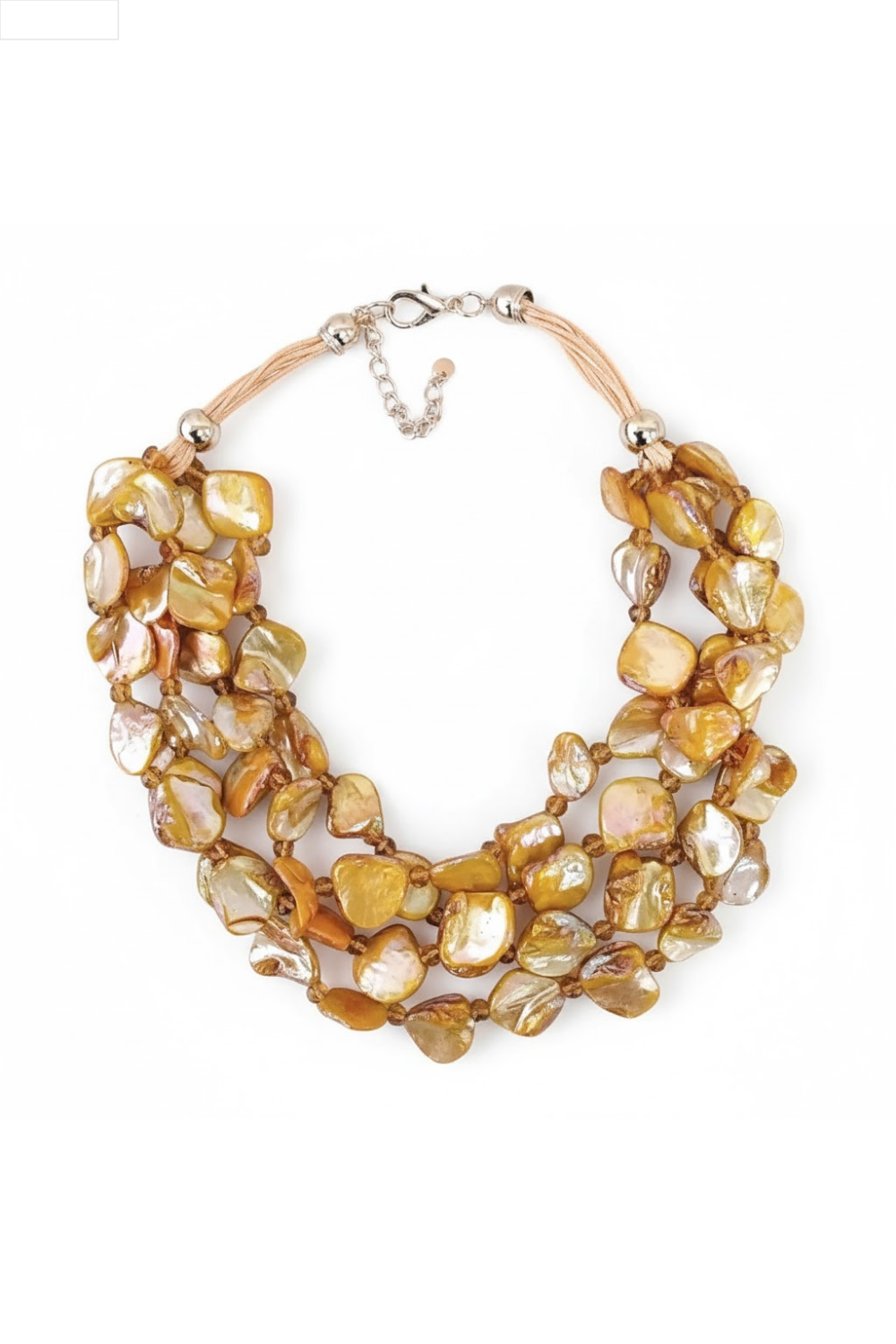Multistrand necklace with beige and white shells on a white background