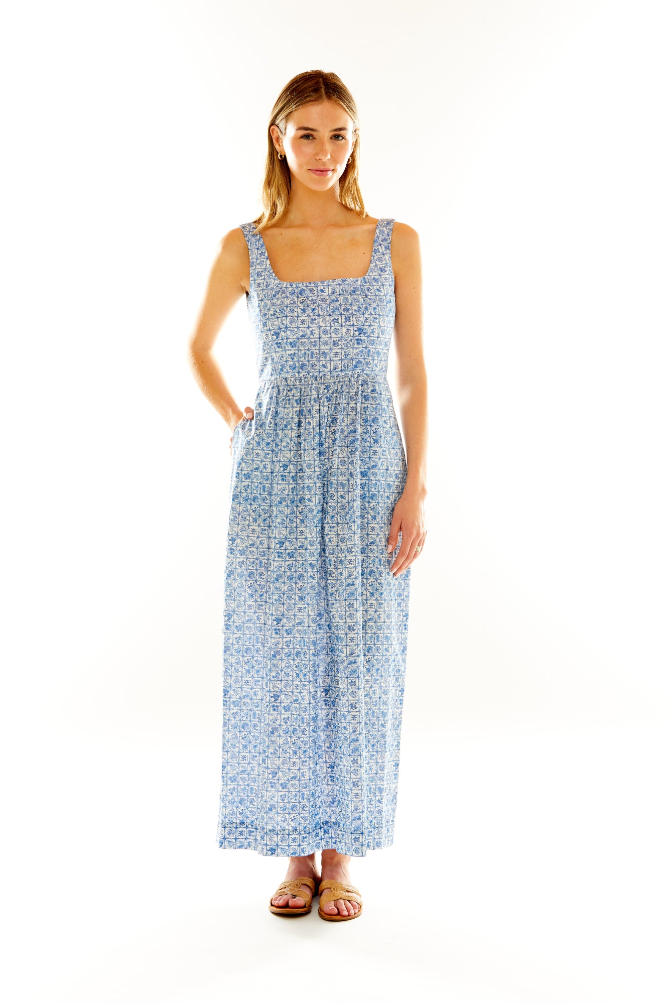 Woman in blue floral maxi dress