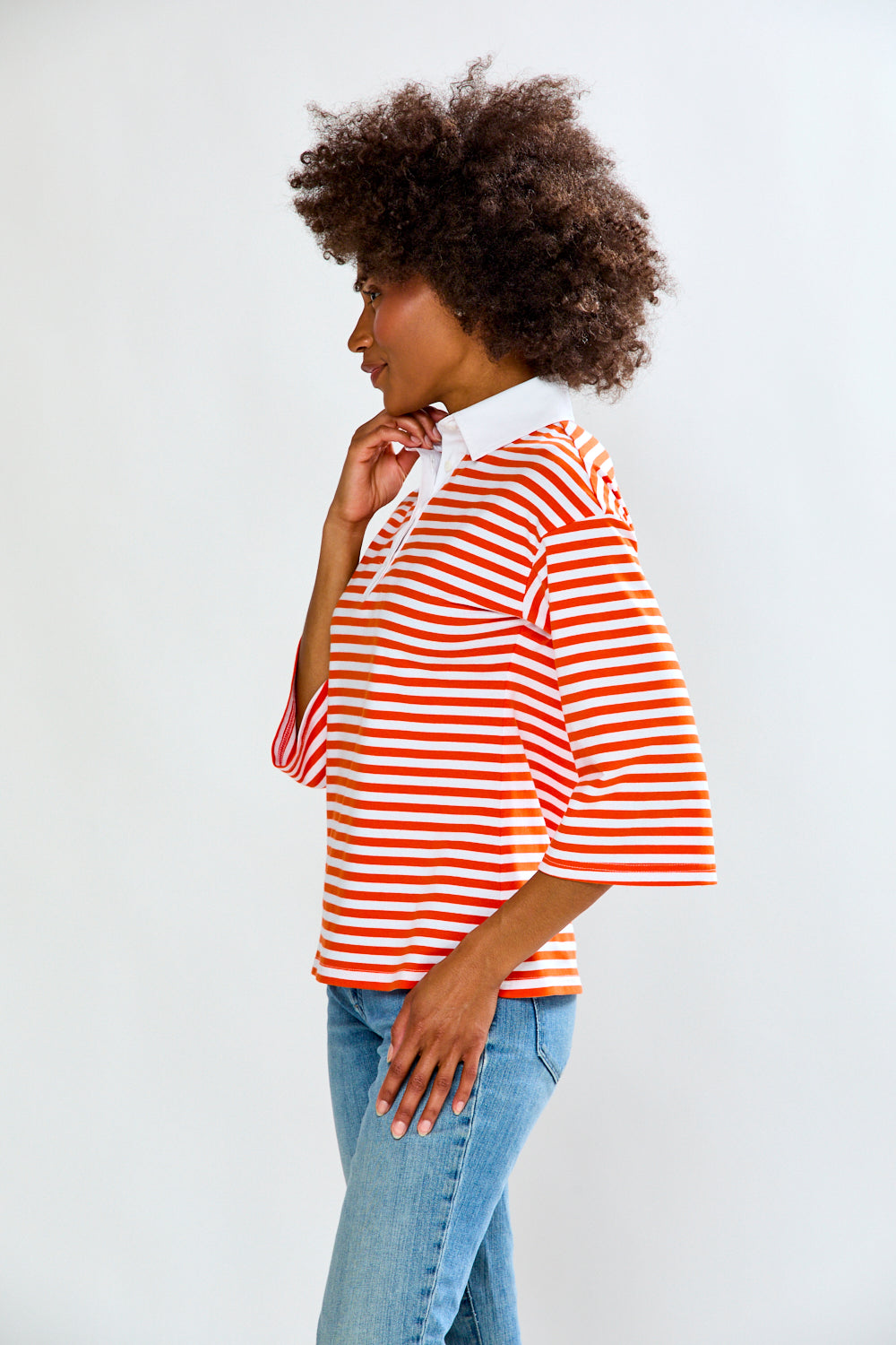 Woman in Orange & White Stripe top