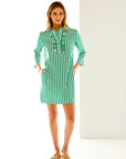 Woman in green and white striped dress