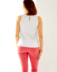Woman in white sleeveless top