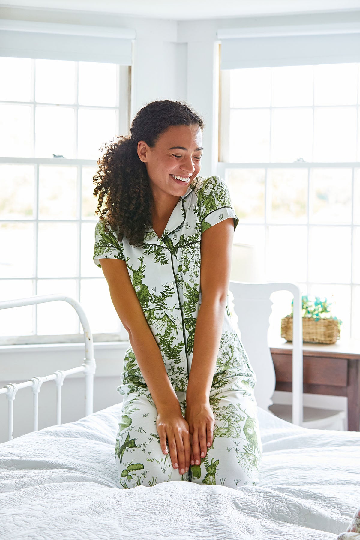 Woman in green and white pajamas