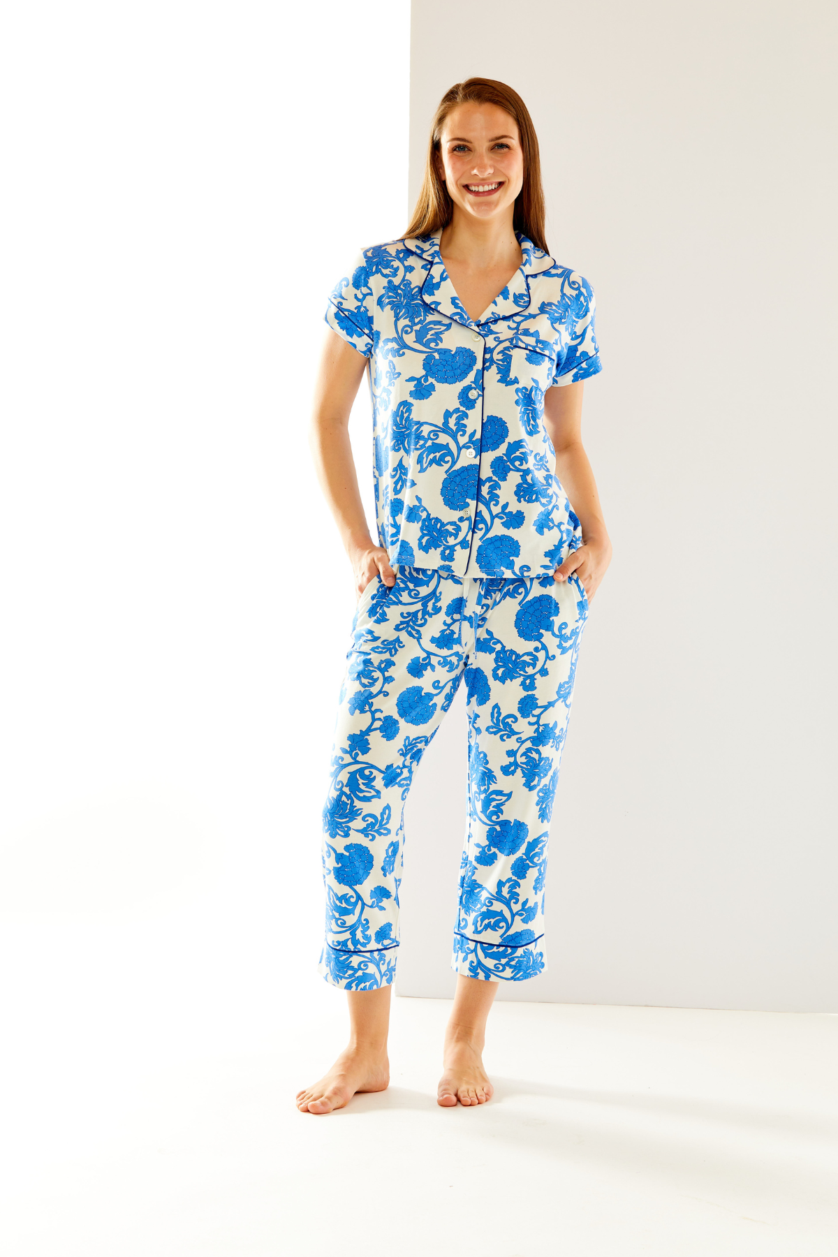 Woman in blue and white pajamas