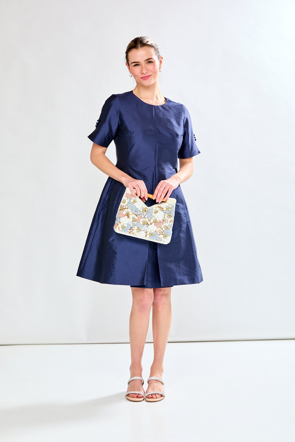 Woman in navy taffeta dress