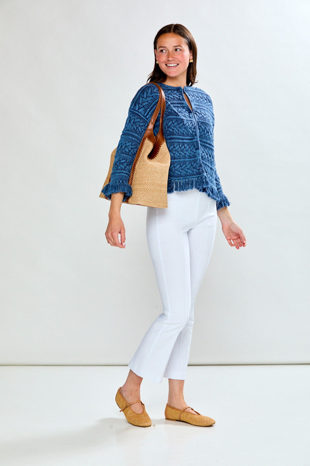 Woman in denim fringe cardi