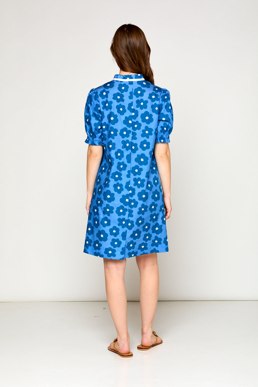 Woman in blue daisy dress