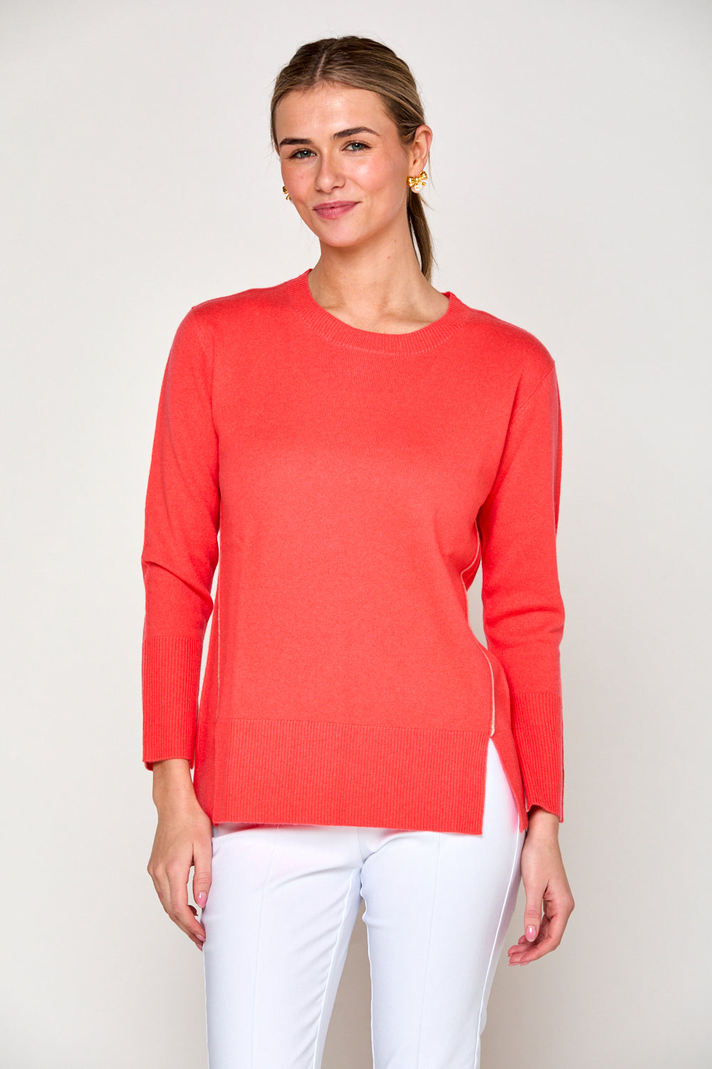 Woman in coral sweater