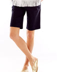 Woman in navy shorts