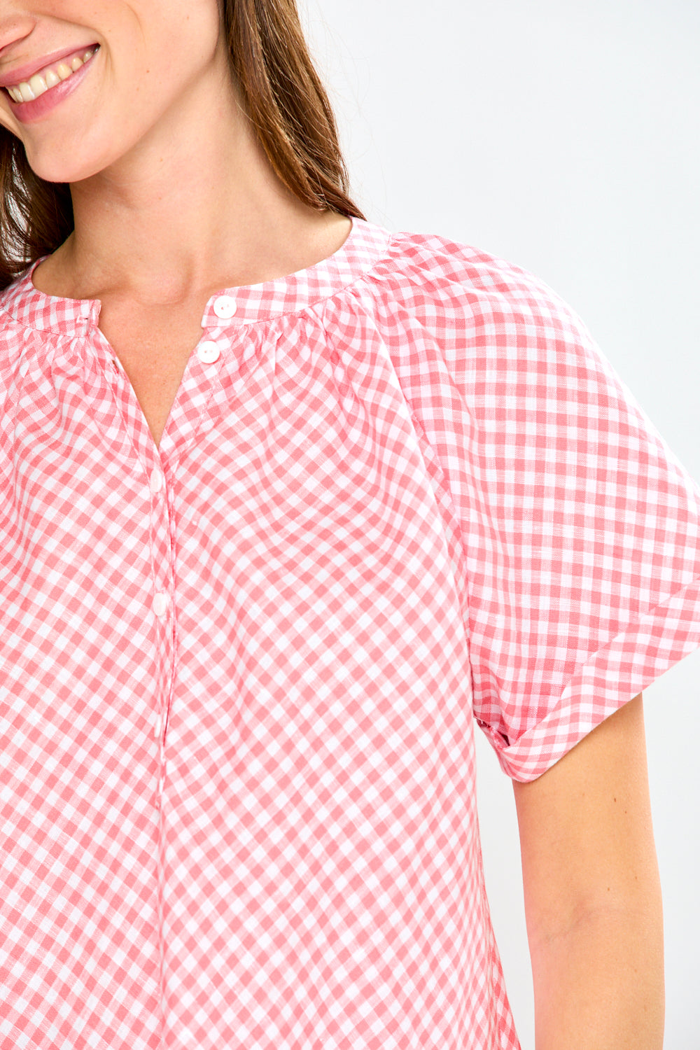 woman in pink gingham top