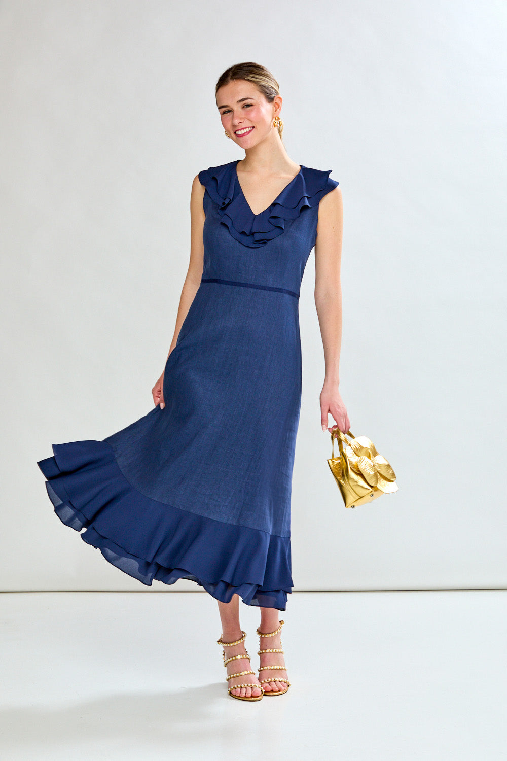 Woman in navy tea length dress