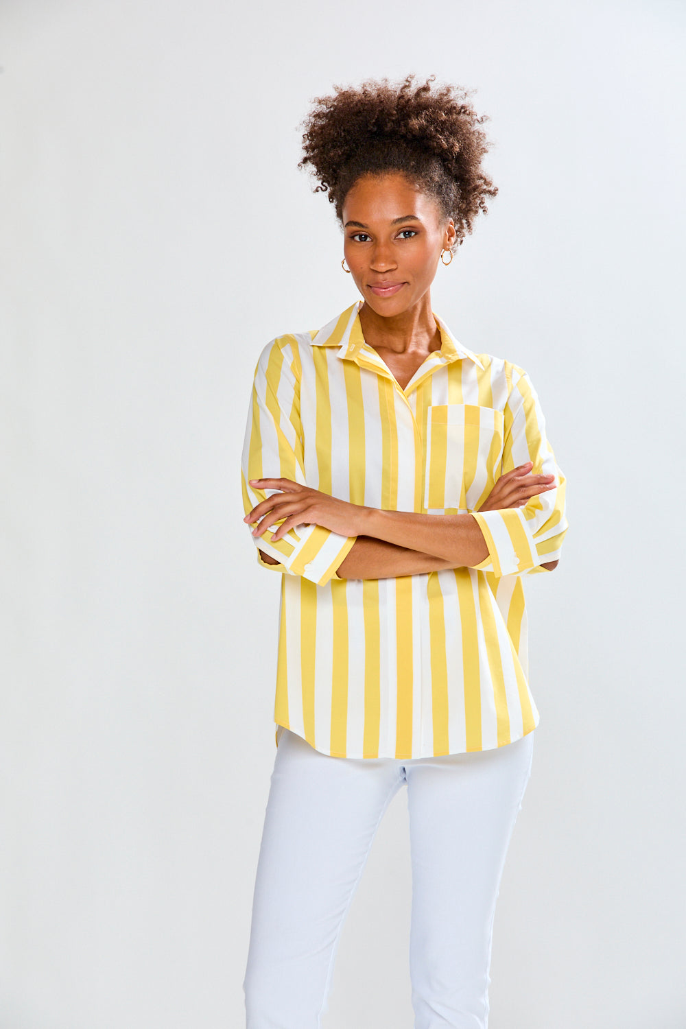 Woman in yellow and white striped top