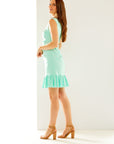 Woman in summer mint dress with ruffle 