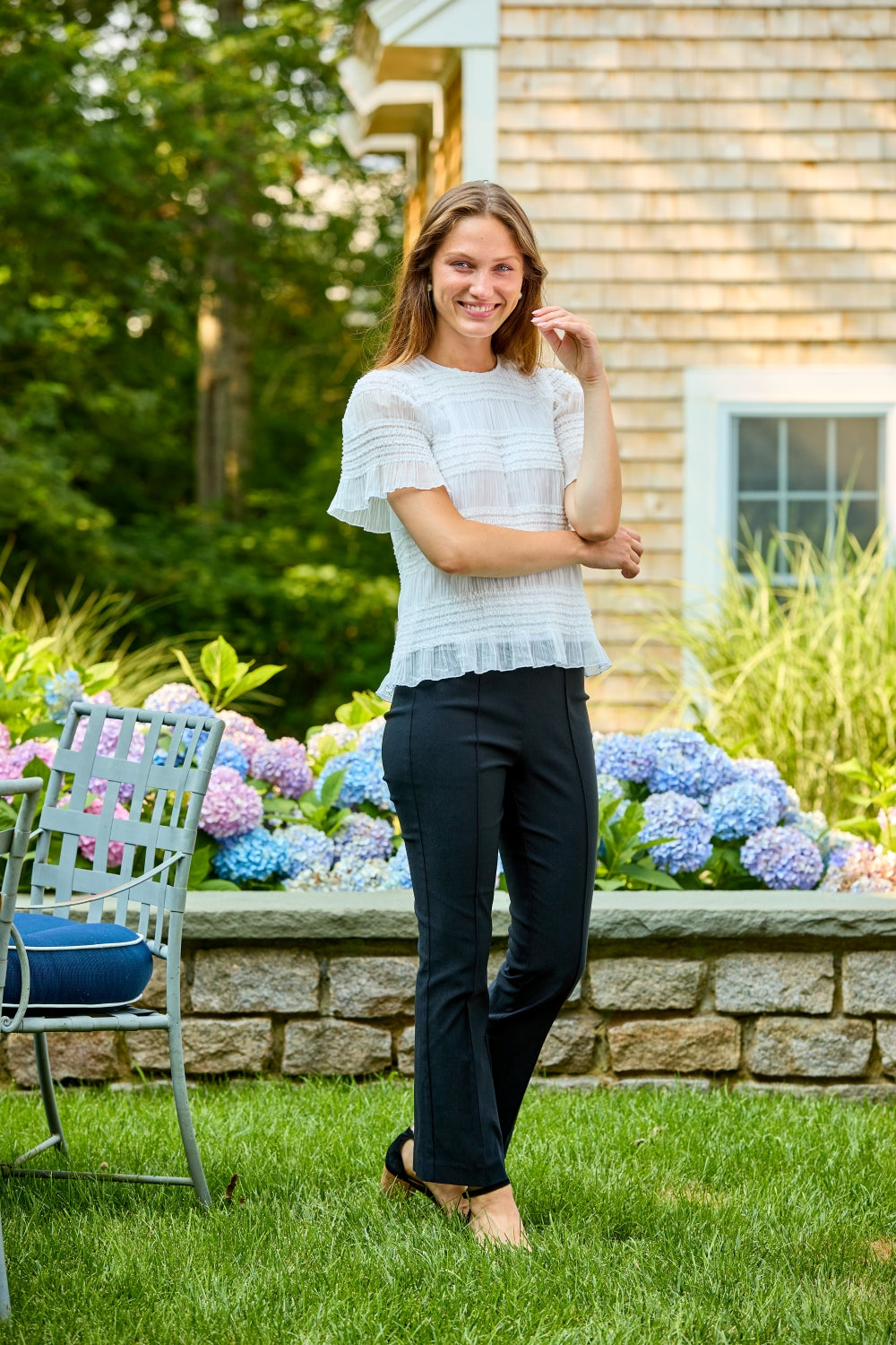 Woman in ivory short sleeve top