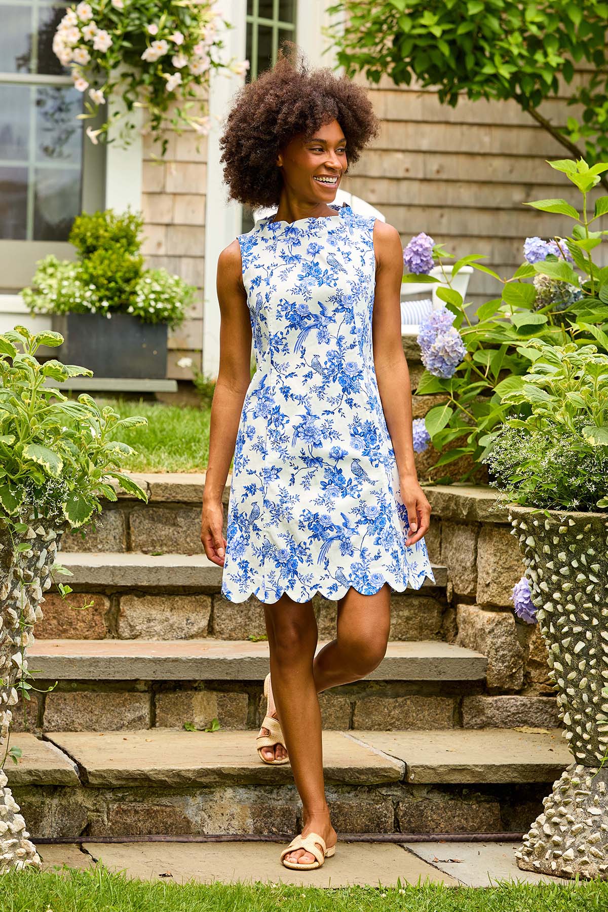 Woman in blue floral print dress