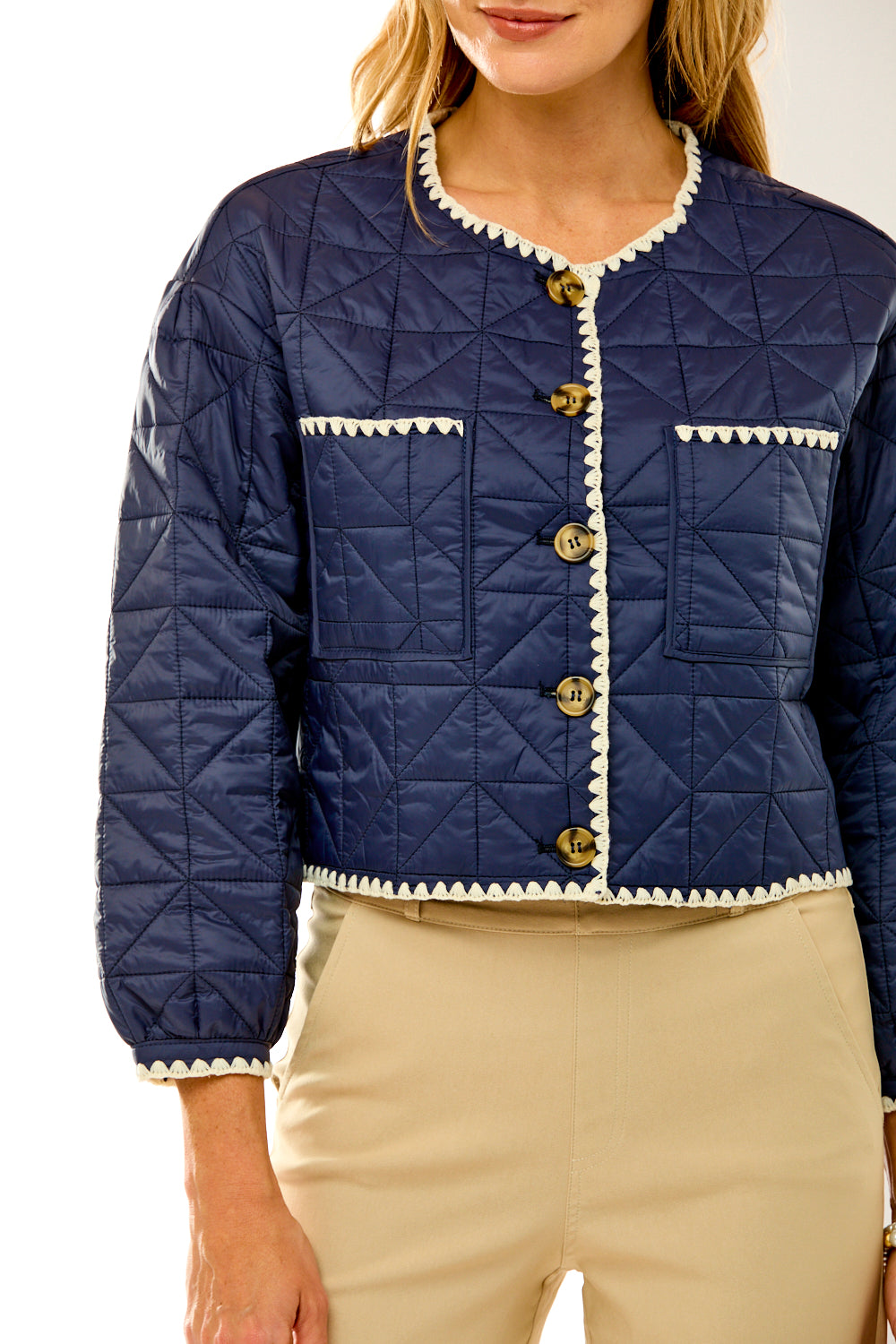 Woman in navy quilted jacket