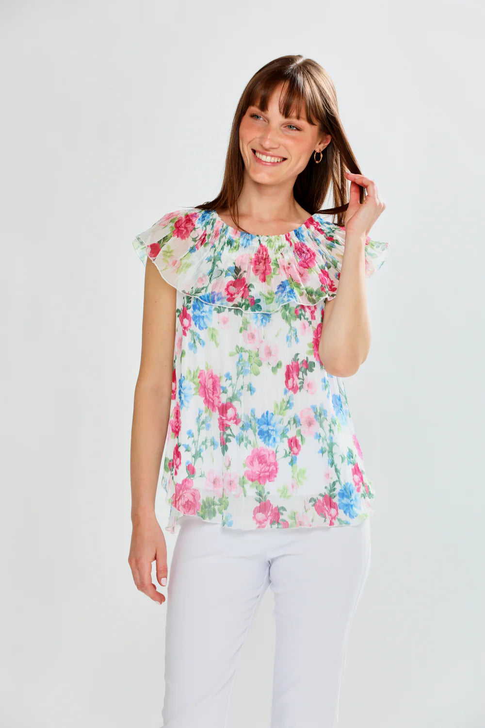Woman wearing a floral top on a white background