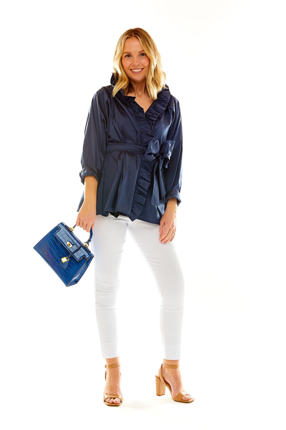 Woman in navy taffeta blouse