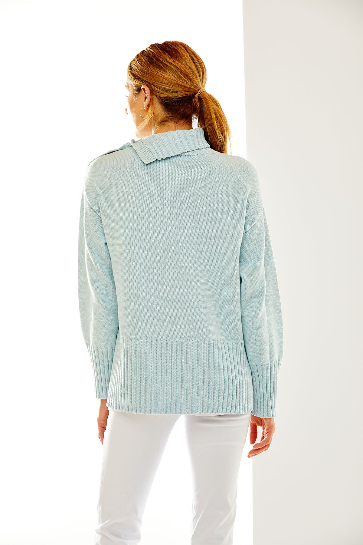 Woman in light blue sweater