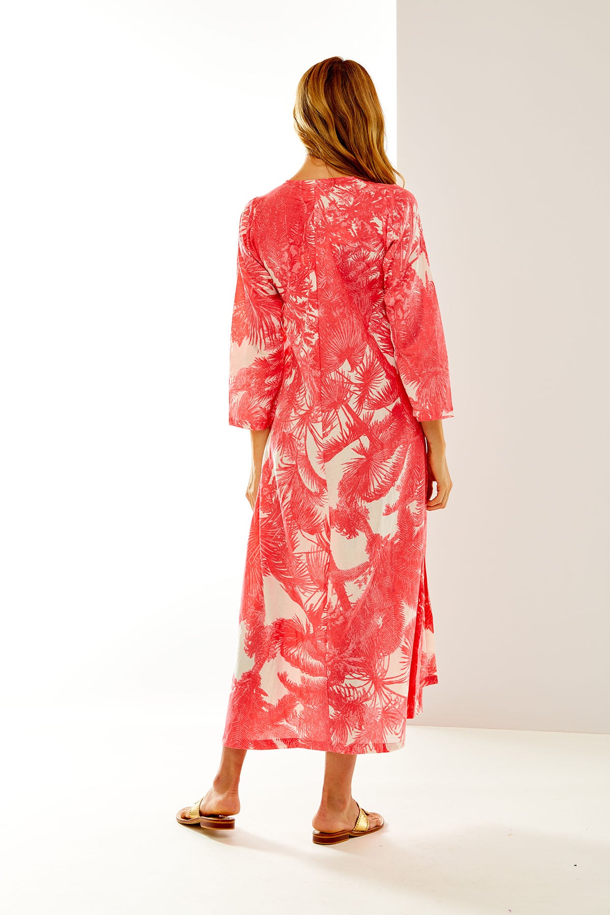 Woman in coral leaf tunic
