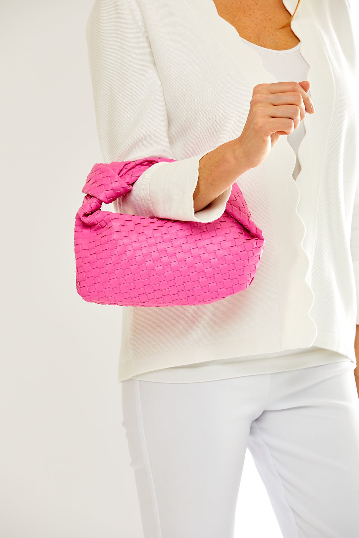 Woman holding a pink bag