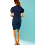 Woman in new indigo dress with puff sleeves