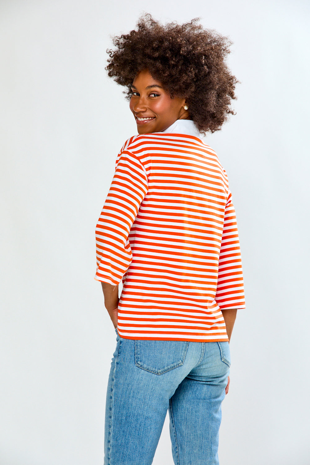 Woman in Orange & White Stripe top