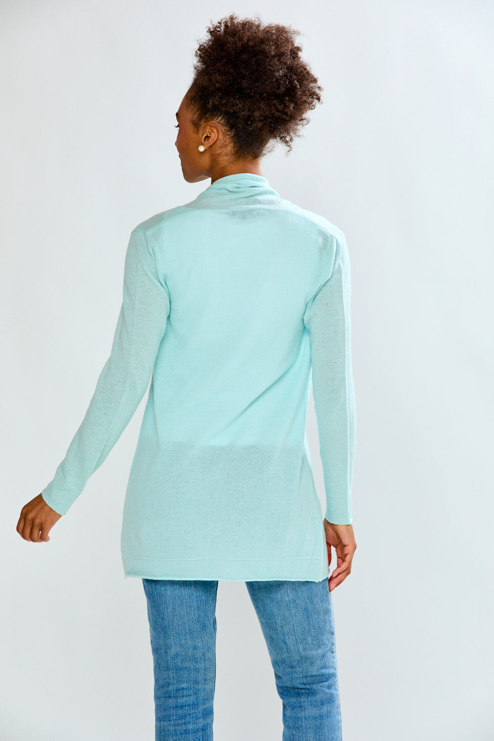 woman in sea glass sweater