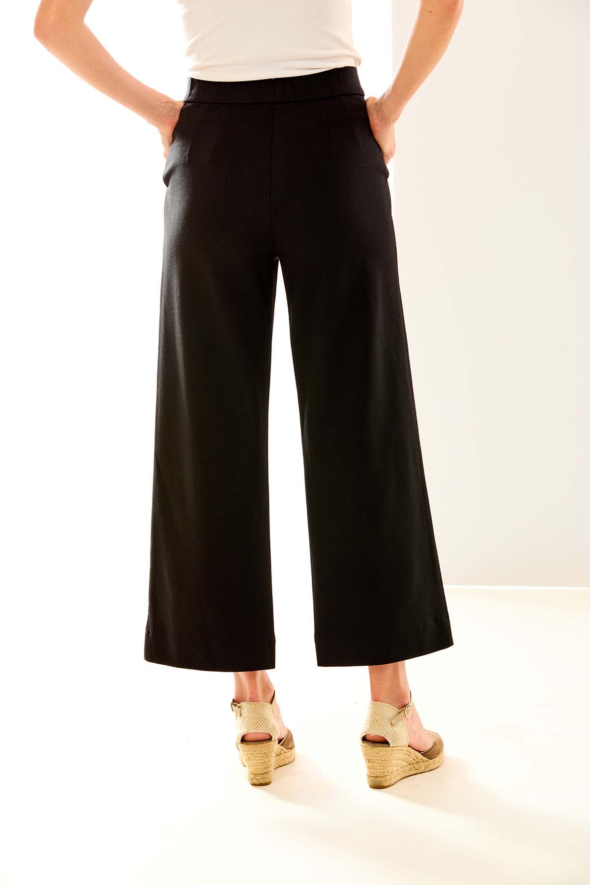 Woman in black wide leg pant