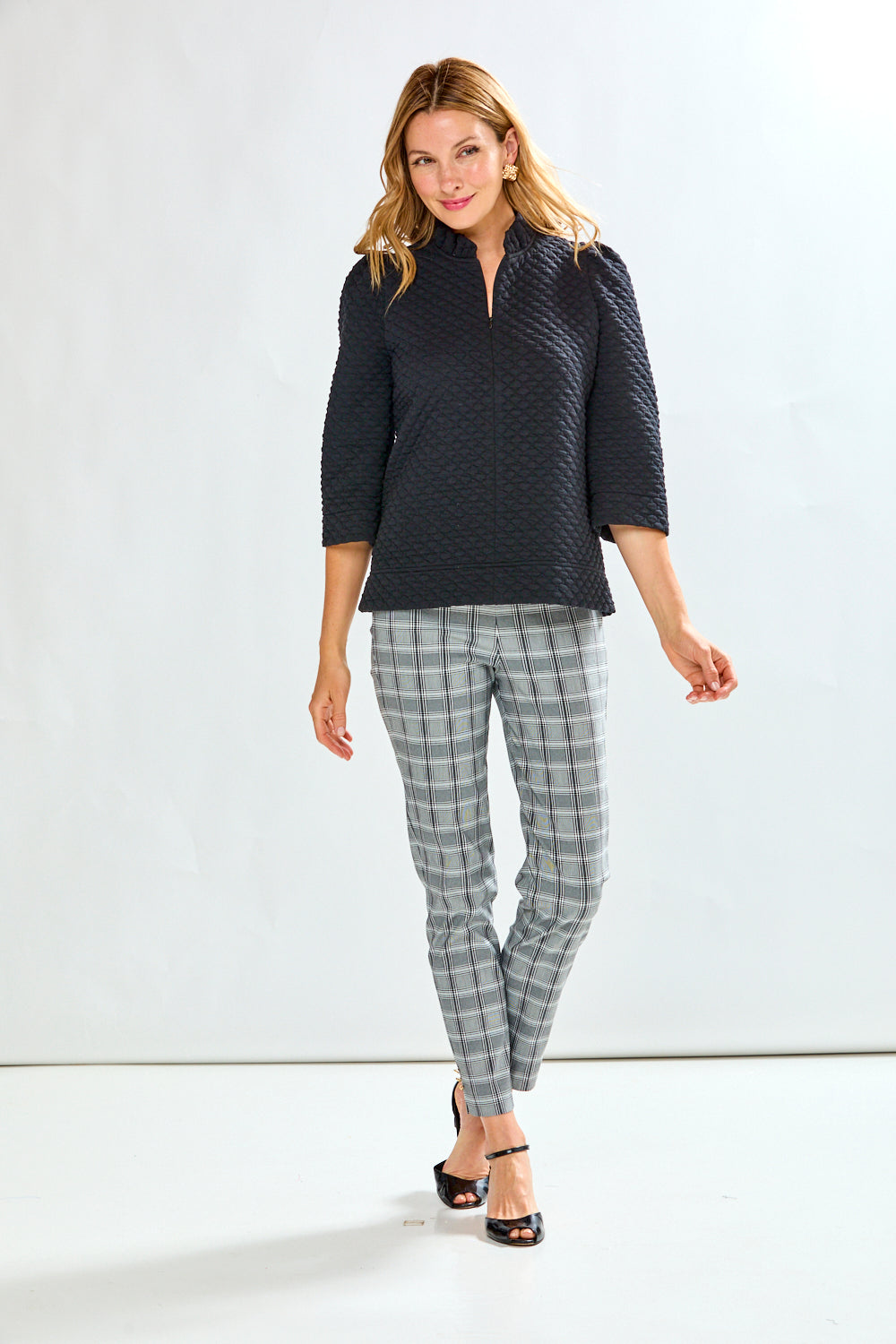 Woman wearing plaid pants 