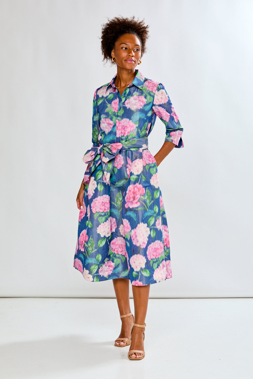 Woman in tea length floral dress
