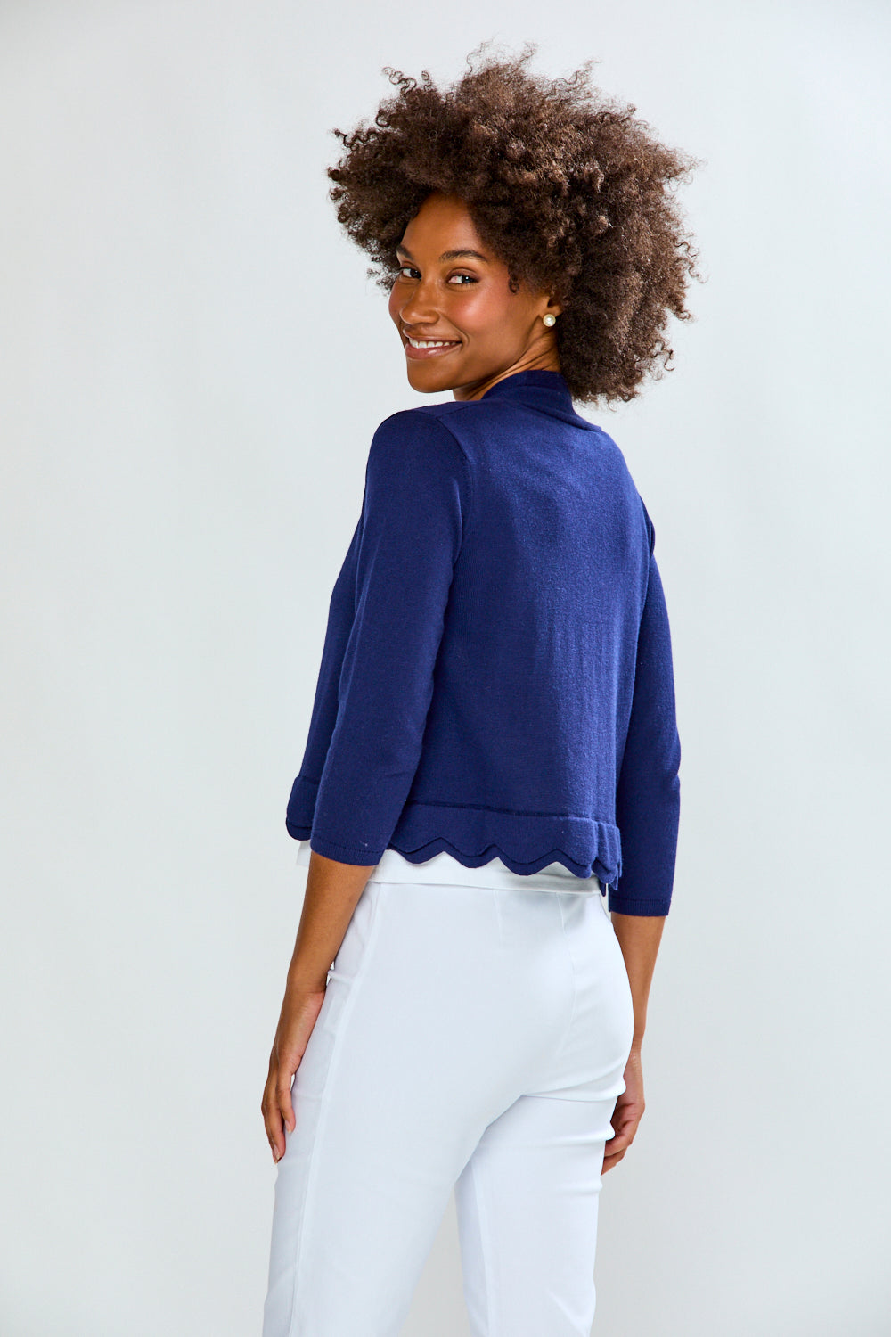 Woman wearing The New Scallop Cardigan - Navy