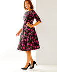 Woman in fit and flare floral dress