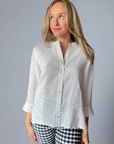Woman in white linen top