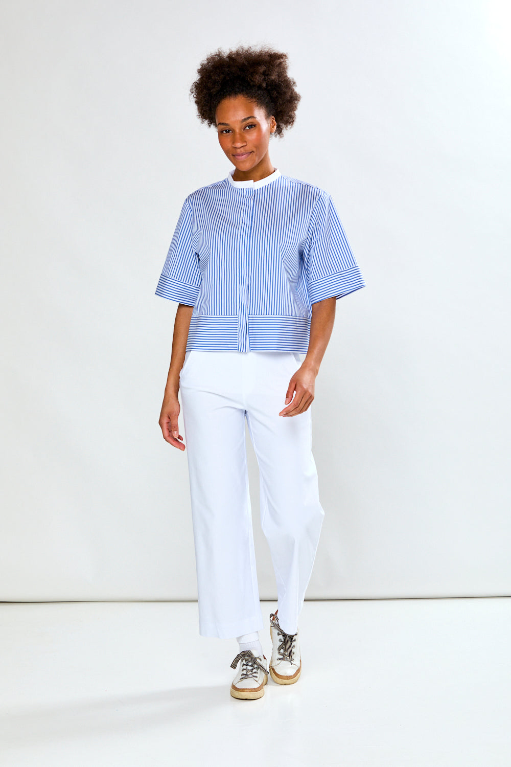 Woman in blue and white striped blouse