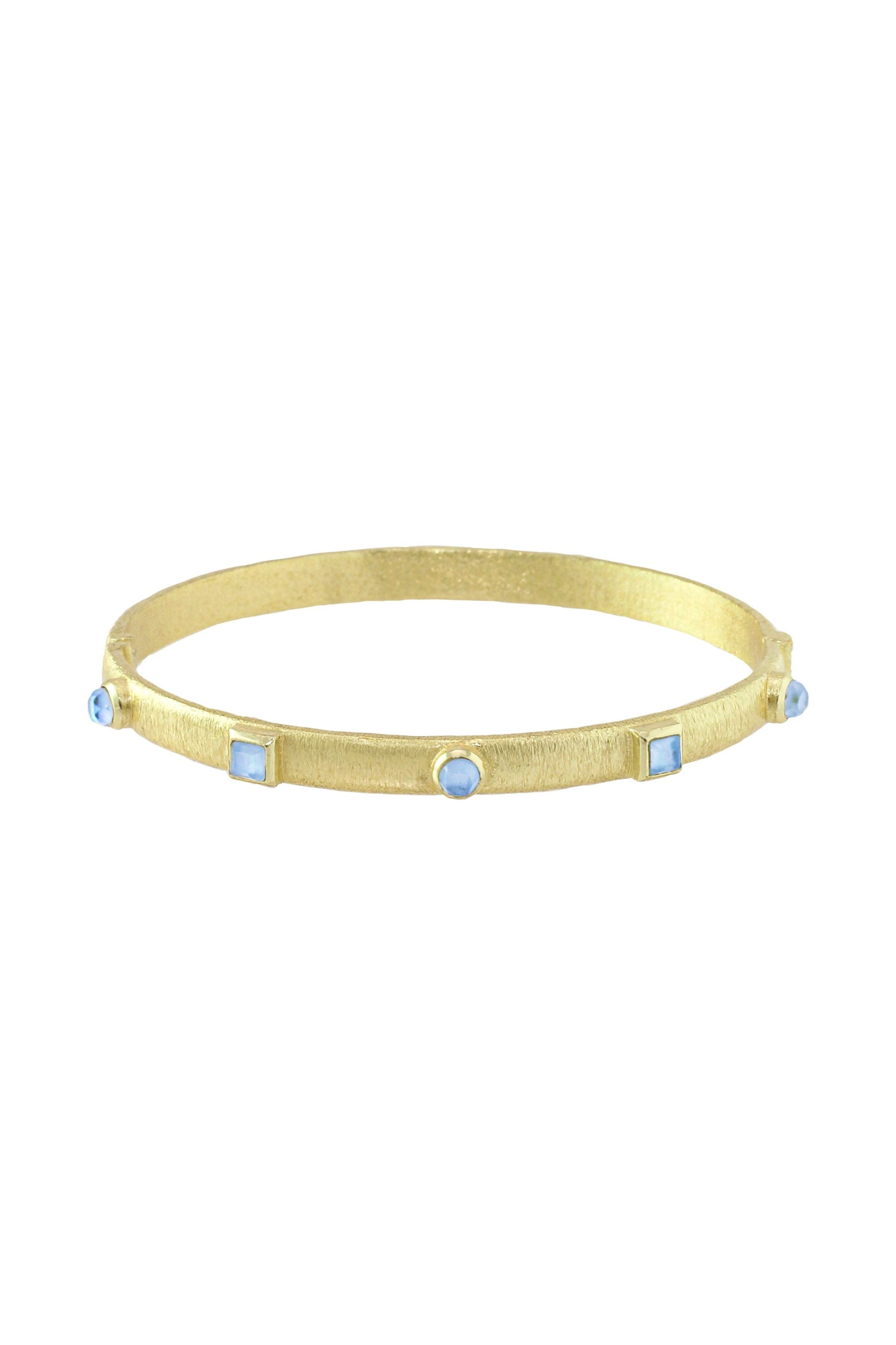 Gold bangle with blue stones