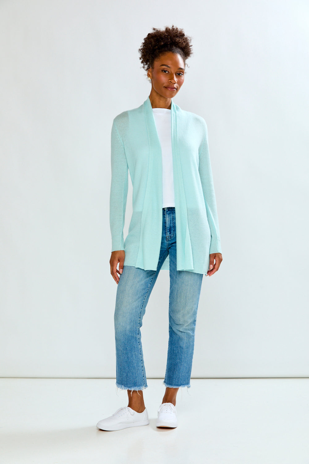 woman in sea glass sweater