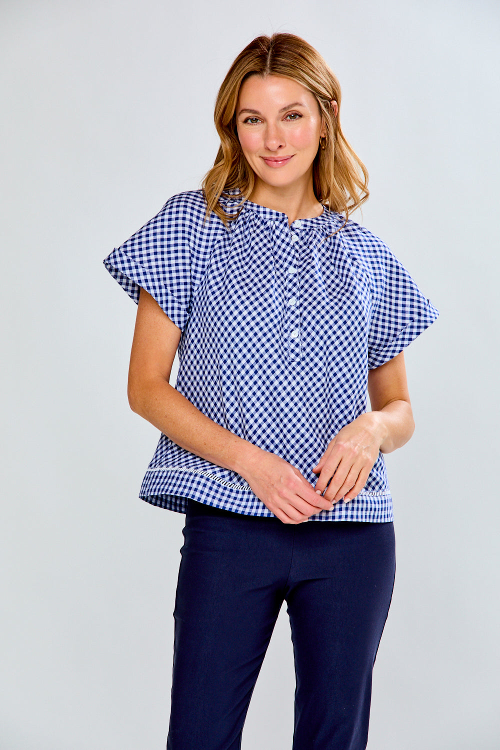 woman in navy gingham top
