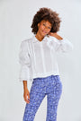 Woman wearing The Arlo Top in White