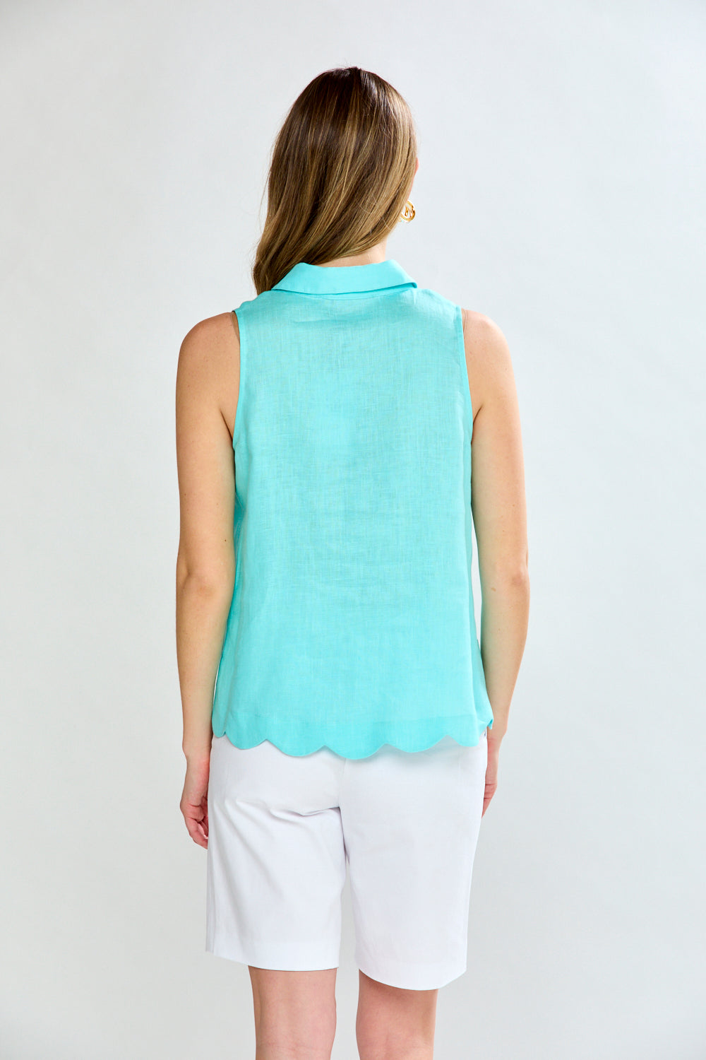 Woman in aero blue sleeveless blouse