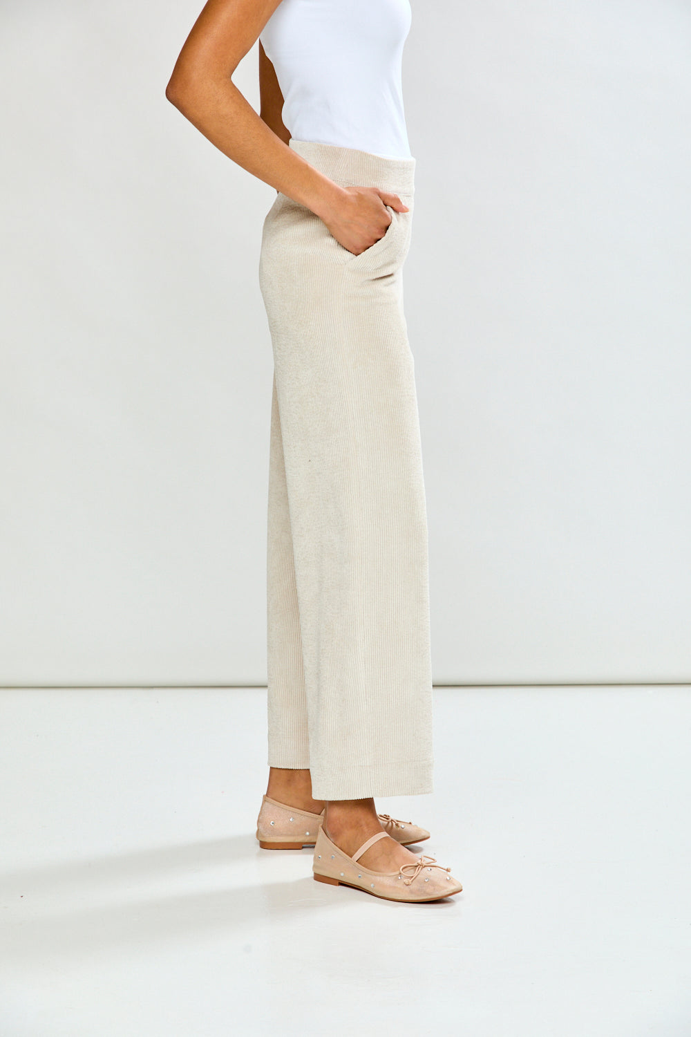 Woman in oyster corduroy pant