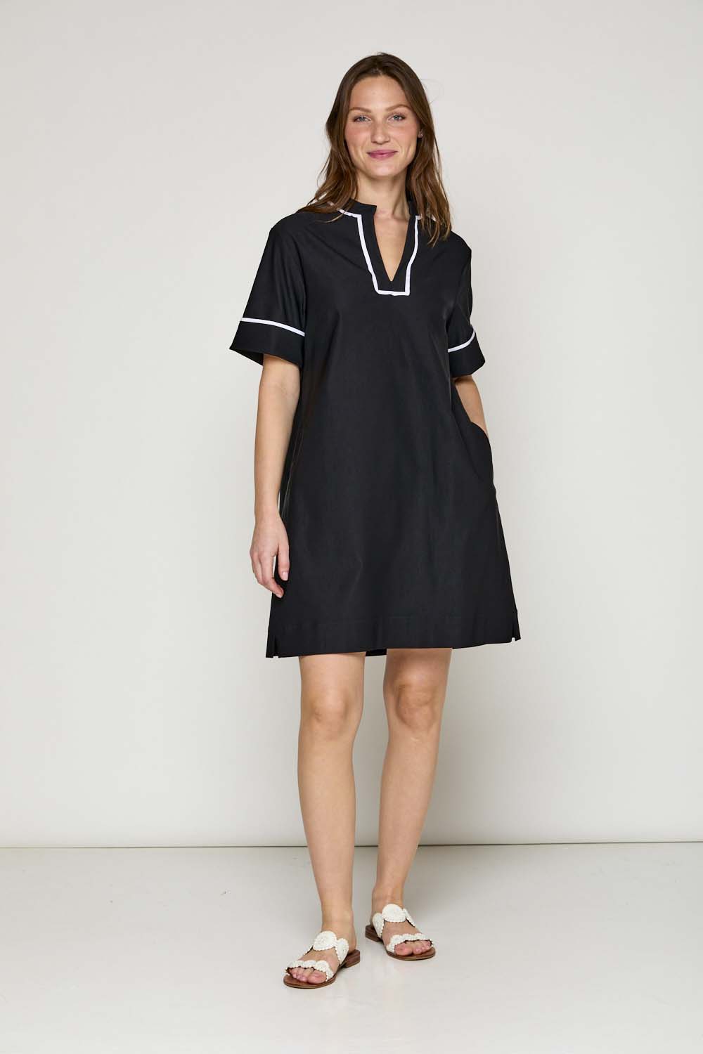 Woman in black short sleeve dress