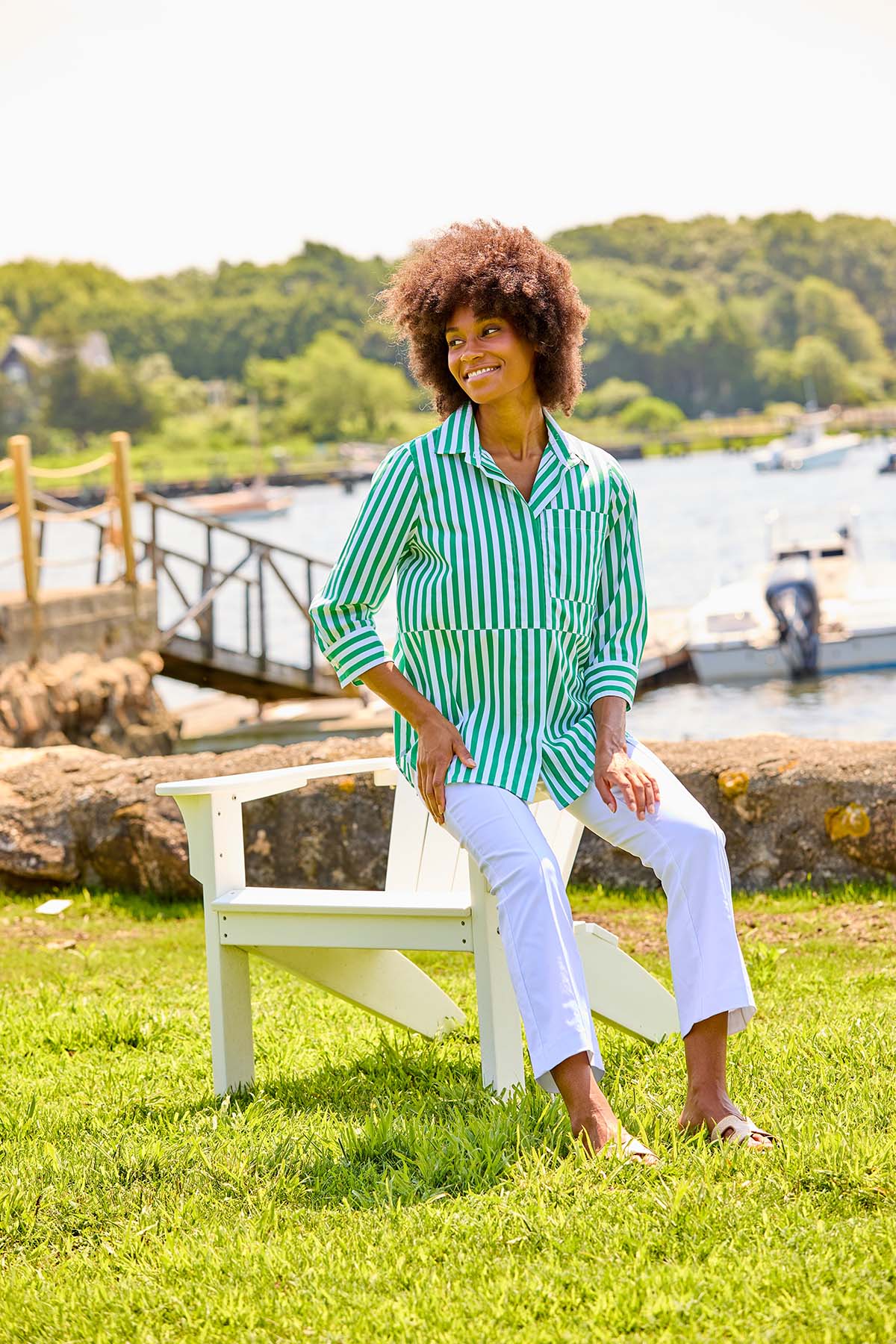 Woman in green and white stripe blouse