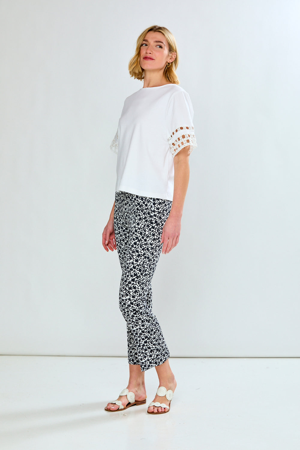 Woman in white top and printed pants