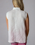 Woman in white sleeveless linen top