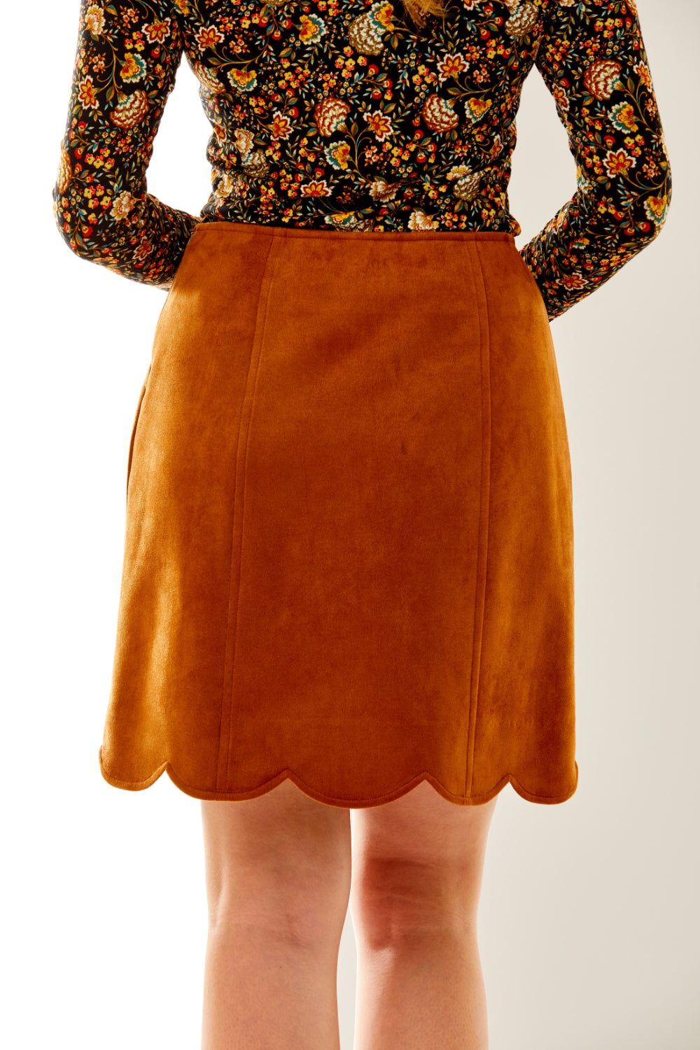 Woman in faux suede skirt