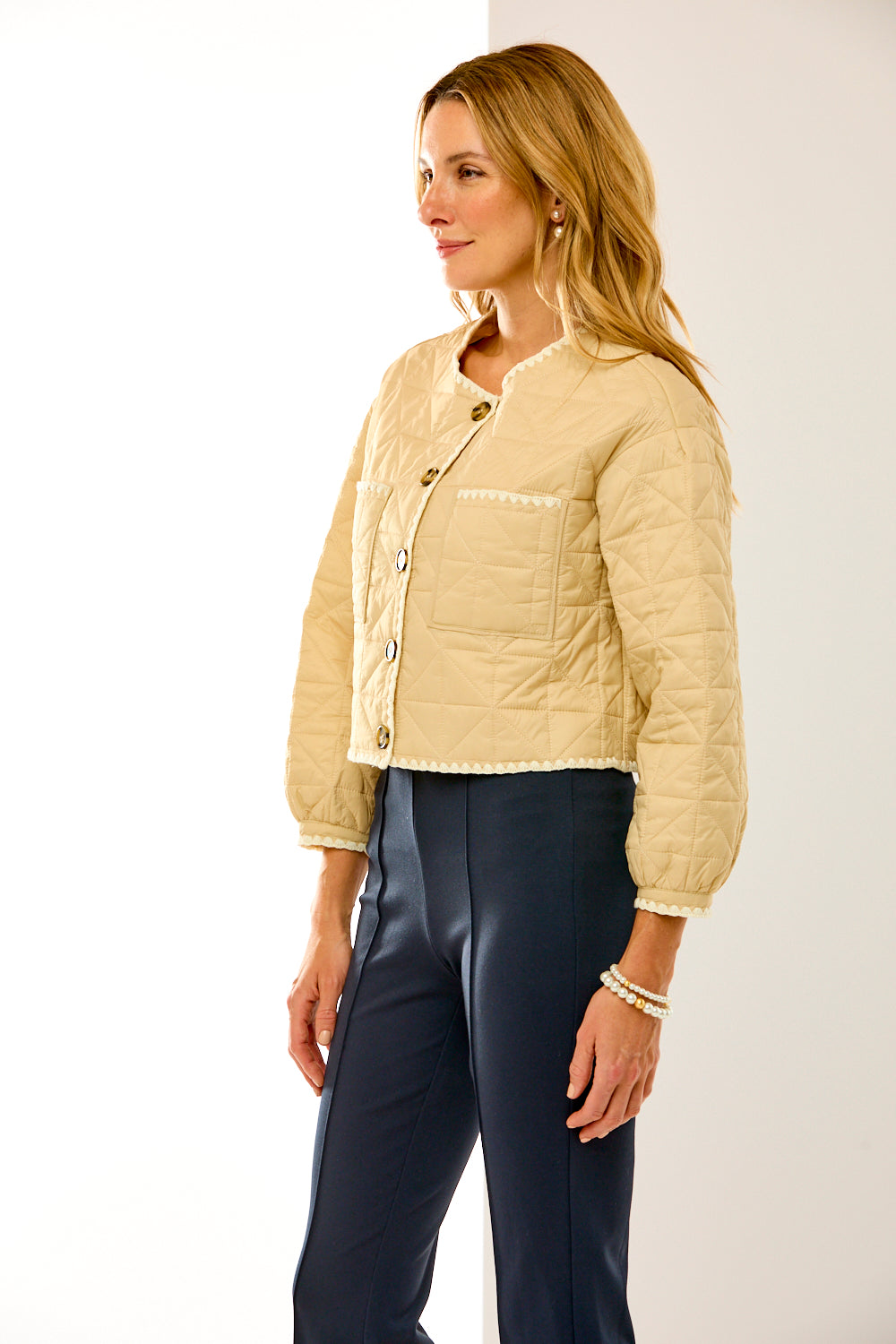 Woman in sand quilted jacket