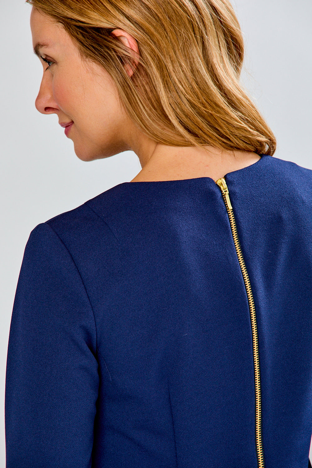 Woman in navy crepe dress